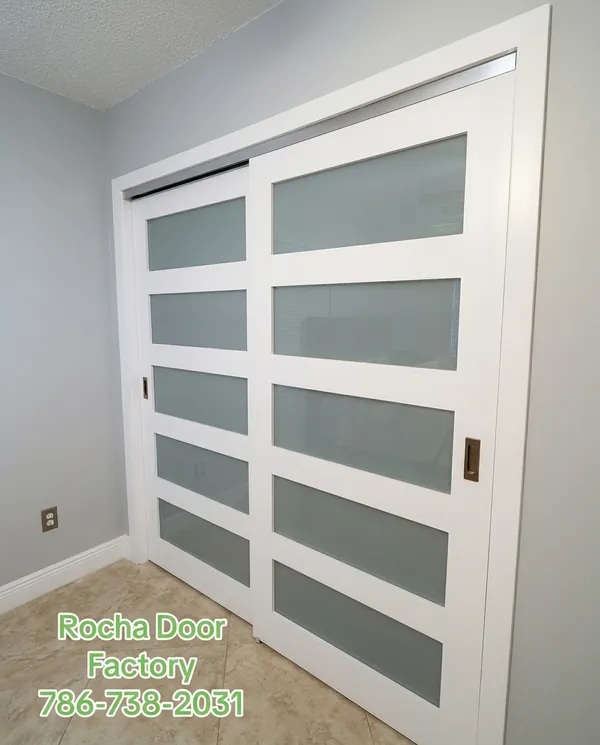 White multi-lite sliding closet doors with frosted glass