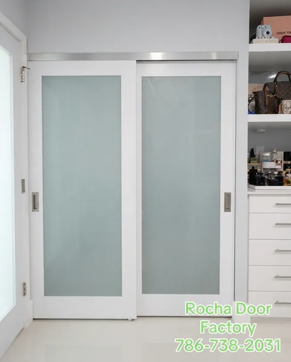 Walk-in closet with frosted sliding glass doors