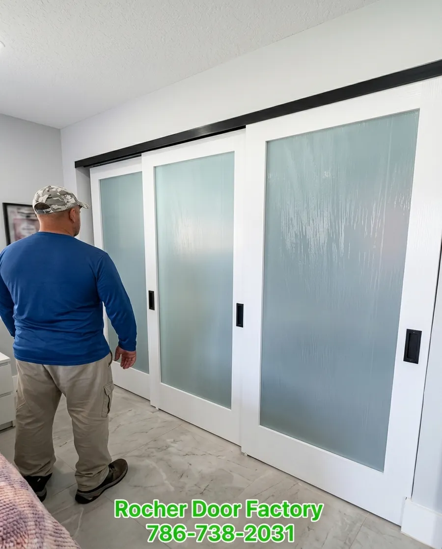 Three-panel frosted glass sliding closet doors installed by Rocha Door Factory