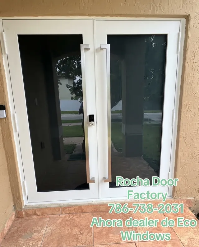 White double impact doors with tinted glass