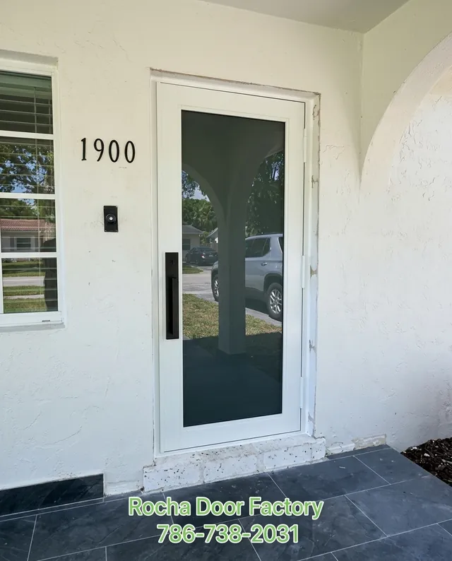 White full-glass impact front door on a Miami home